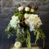 "Jessie&rsquo;s Girl" is a lush and elegant arrangement featuring creamy white roses