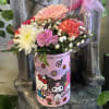 Fresh flowers in hello kitty canister 