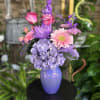 fresh flowers in purple vase 

The color of Gerber flowers may vary