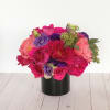 An eye-catching display of mixed spring floral in rich bold color tones.
