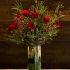  Dozen long stem roses with greens and beautiful wax flower. We