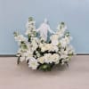 This arrangement reflects the imagery of purity and spirituality with the white