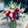 This bouquet is filled with roses, spray roses, snapdragons and mix eucalyptus.

We