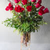 Two Dozen South American red roses elegantly displayed in high end vase