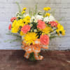Vase full of bright orange and yellow flowers.  Sure to make