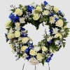 This blue and white open heart has blue delphenium, white roses, white