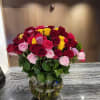 This is a beautiful arrangement in a clear glass vase with a