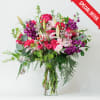 A pink flower arrangement for a special person would typically feature a