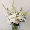 An assortment of all white flowers that makes a subtle statement. 