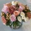 A soft colored rose arrangement! 

Approximate size 10"x10" 