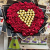 100 red roses around ferrero rocher heart. Amount of roses will vary
