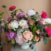 Wow! This stunning arrangement features a meadow of spring flowers in shades