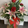 A classic combination of lilies and roses.  
