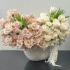 Charming and elegant, this classic arrangement features a full, dense display of