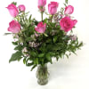  These beautiful medium length hot pink roses are complemented with wax