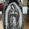 Virgen Mary  shawl with a beautiful arrangement on top. 