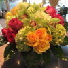 Yellow roses, lime green hydrangea, hot pink roses , cymbidium orchid in