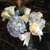 Graceful and versatile arrangement of roses, hydrangea, and callas. Perfect for many
