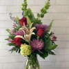 A pretty bouquet with Lilies, roses, cremones, &amp; other summery flowers.