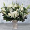A BEAUTIFUL SERENE ARRANGEMENT IN ALL WHITE WITH ROSES, HYDRANGEAS, AND ORIENTAL