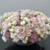 A classic and timeless arrangement abundant with lush blooms. Designed in a