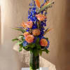 Blue and orange with Birds of Paradise, Hydrangeas, Delphinium and Roses arranged