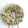 This Medium white wreath comes with a goregous mixed of white flowers