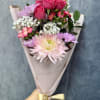 Our petite Pink Breeze hand-tied bouquet features cheerful mums, spray roses, daisies