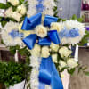 A serene 30&rdquo; sympathy cross featuring pure white roses, soft white cushion
