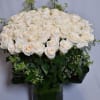 A cylinder vase with 100 Long stem white roses with greenery 

Perfect