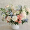 Seasonal Blooms in the sweet shades of pastel arranged with touches of