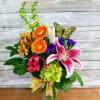 Everyone loves Spring. Send this bright and colorful arrangement including gerbera daisies