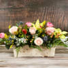 Peach and pink Roses, Orchids, Lilies, ranunculus and mixed greenery in a