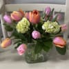our own farm grown tulips arranged in a short square vase. Tulip