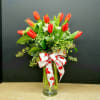 Tickle her with tulips! This elegant bouquet of ten red tulips is