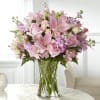 An array of blushing pink blooms come together beautifully to express your