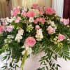 Soft, tender, and peaceful, this elegant casket spray features blush pink roses