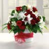 Classic Arrangement of Lillies and red roses, appropriate for any occasion.
Note: This