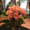 Dozen pink roses with touch of hydrangea , exotic leave, tall vase