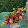 An A-symmetrical sunset themed floral arrangement that compliments our phoenix sunset sky.
