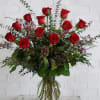 A dozen of our longest-stemmed premium red roses are expertly arranged alongside
