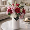 The Radiant Romance is a romantic, garden-inspired floral arrangement designed to make