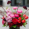 Pinks, fuchsia, red and burgundy floral in a clear ti leaf lined