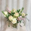 Romantic pastels and delicate scents. Half dozen roses with added mixed blooms.