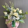 Aqua tones are refreshing in this arrangement. Featuring blue hydrangeas and delphiniums