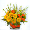 Bright and lovely sunflowers arranged in a centerpiece style with orange equadorian
