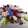 Brilliant flowers such as blue hydrangea, red roses, white oriental lilies and