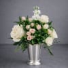 A timeless garden-style arrangement featuring soft white roses, delicate blush spray roses