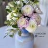 A lovely mermaid inspired iridescent vase filled with soft pastel dahlias and