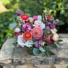 Warm toned dahlias and lavender muted hues accented with pops of color